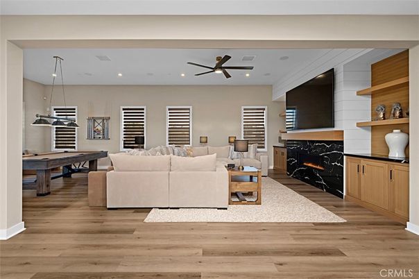 Billiard Table, Fireplace, Game Room, Interior, Living room, Pendant Lights, Recessed Lighting, Wood Texture Flooring