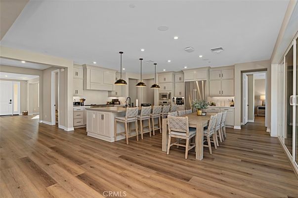 Dining room, Interior, Kitchen, Pendant Lights, Recessed Lighting, Stainless Steel Appliances, Wood Texture Flooring