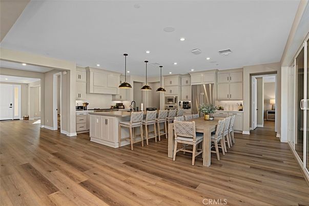Dining room, Interior, Kitchen, Pendant Lights, Recessed Lighting, Stainless Steel Appliances, Wood Texture Flooring
