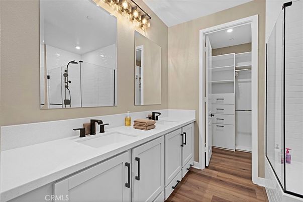 Bathroom, Dual Sink Vanities, Interior, Recessed Lighting, Walk-in Closets, Wood Texture Flooring