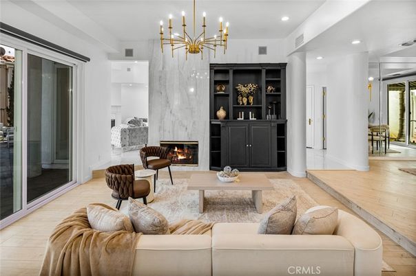 Fireplace, Interior, Living room, Marble Walls, Pendant Lights, Recessed Lighting, Wood Texture Flooring