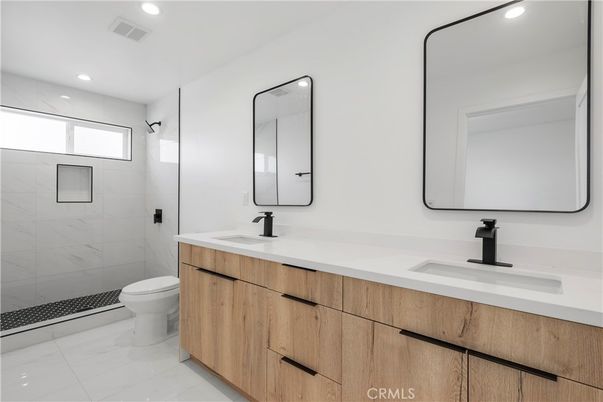 Bathroom, Dual Sink Vanities, Glass Shower, Interior, Marble, Marble Walls, Recessed Lighting