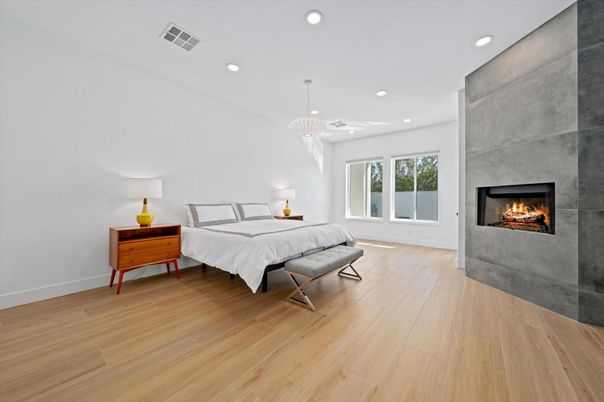 Bedroom, Fireplace, Interior, Pendant Lights, Recessed Lighting, Wood Texture Flooring
