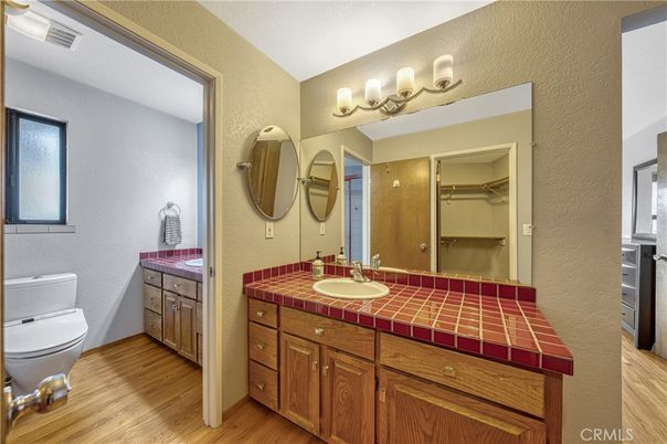 Bathroom, Dual Sink Vanities, Interior, Tile Countertops, Wood Texture Flooring