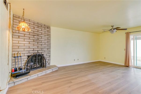 Empty room, Fireplace, Interior, Pendant Lights, Stone Walls, Wood Texture Flooring