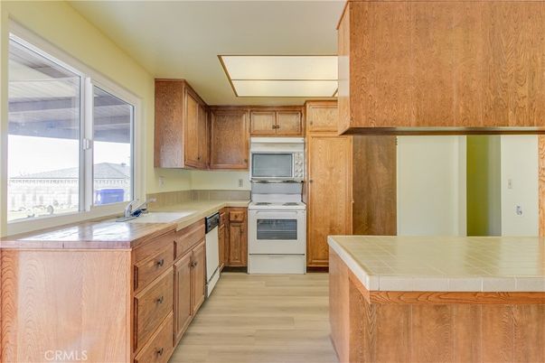 Interior, Kitchen, Tile Countertops, Wood Texture Flooring