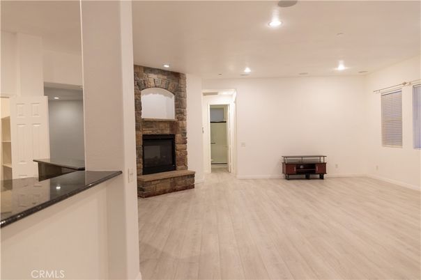 Fireplace, Interior, Recessed Lighting, Stone Walls, Wood Texture Flooring