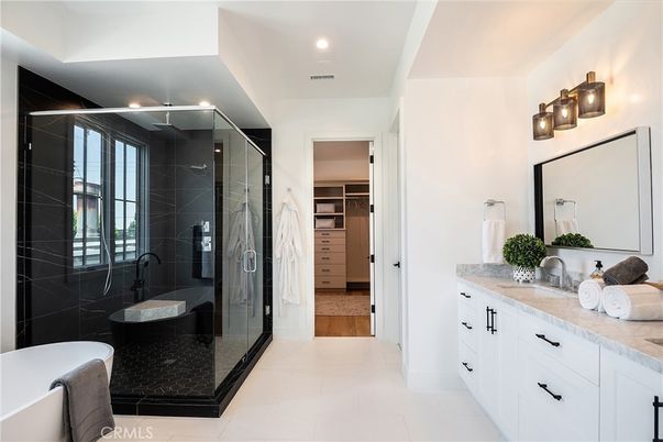 Bathroom, Dual Sink Vanities, Glass Shower, Interior, Recessed Lighting, Walk-in Closets, Wood Texture Flooring