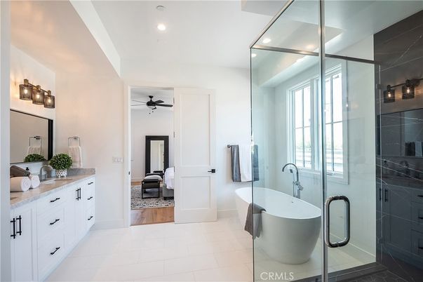 Bathroom, Bedroom, Dual Sink Vanities, Free Standing Baths, Glass Shower, Interior, Recessed Lighting, Wood Texture Flooring