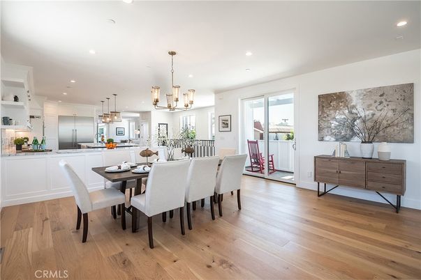 Chandelier, Dining room, Interior, Kitchen, Pendant Lights, Recessed Lighting, Stainless Steel Appliances, Wood Texture Flooring
