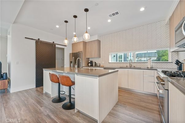 Interior, Kitchen, Pendant Lights, Recessed Lighting, Stainless Steel Appliances, Wood Texture Flooring