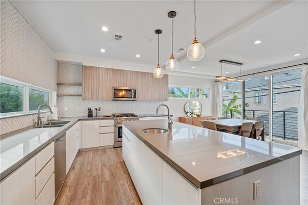 Dining room, Interior, Kitchen, Pendant Lights, Recessed Lighting, Stainless Steel Appliances, Wood Texture Flooring