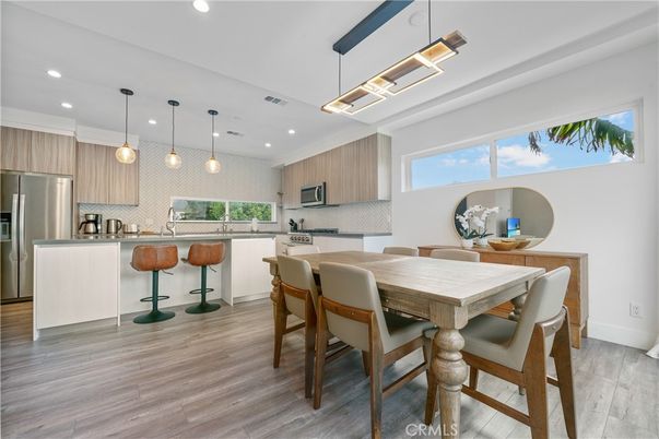 Dining room, Interior, Kitchen, Pendant Lights, Recessed Lighting, Stainless Steel Appliances, Wood Texture Flooring