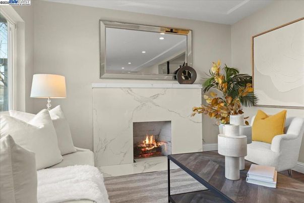 Fireplace, Interior, Marble Walls, Recessed Lighting, Wood Texture Flooring