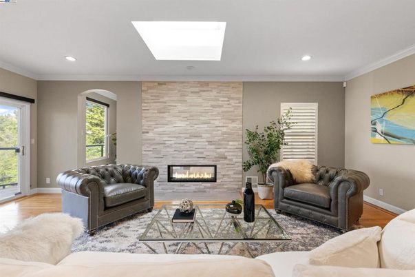 Fireplace, Interior, Living room, Recessed Lighting, Stone Walls, Wood Texture Flooring