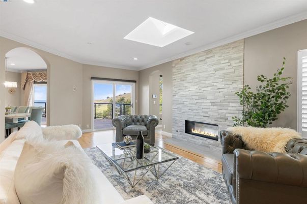 Fireplace, Interior, Living room, Recessed Lighting, Stone Walls, Wood Texture Flooring