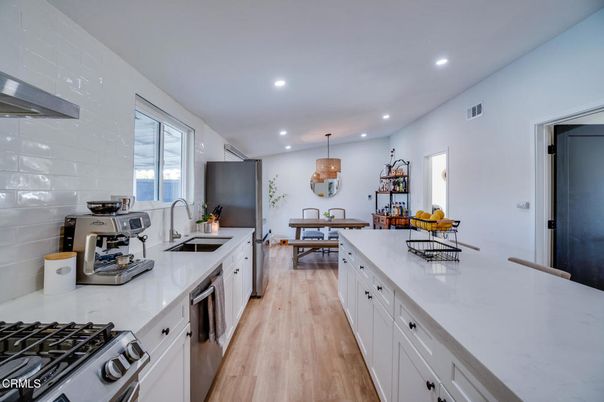 Dining room, Interior, Kitchen, Pendant Lights, Recessed Lighting, Stainless Steel Appliances, Wood Texture Flooring