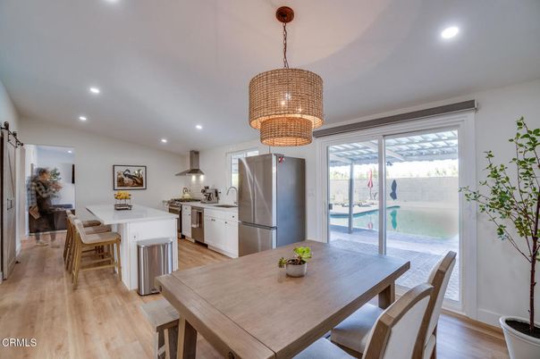 Chandelier, Dining room, Interior, Kitchen, Recessed Lighting, Stainless Steel Appliances, Wood Texture Flooring