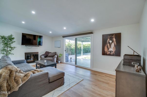 Fireplace, Interior, Living room, Piano, Recessed Lighting, Wood Texture Flooring