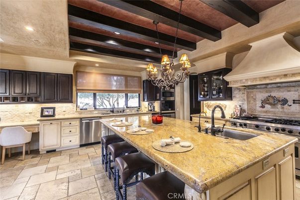 Chandelier, Interior, Kitchen, Recessed Lighting, Stainless Steel Appliances, Stone Walls, Wooden Beams