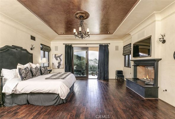 Bedroom, Chandelier, Fireplace, Interior, Recessed Lighting, Wood Texture Flooring