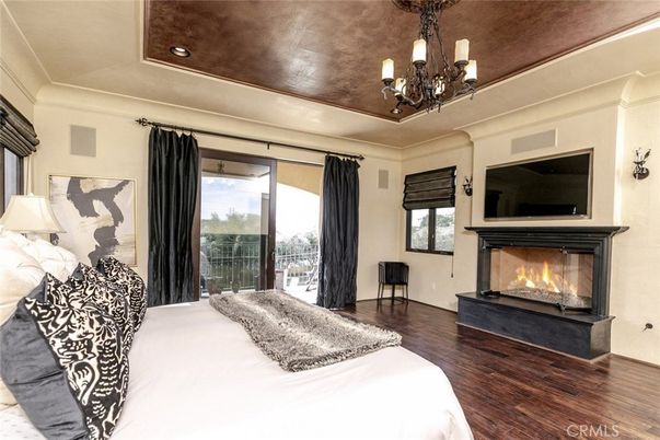 Bedroom, Chandelier, Fireplace, Interior, Recessed Lighting, Wood Texture Flooring