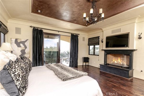 Bedroom, Chandelier, Fireplace, Interior, Recessed Lighting, Wood Texture Flooring