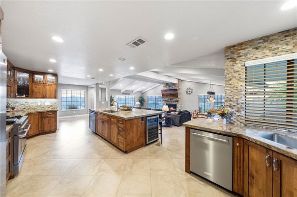 Fireplace, Interior, Kitchen, Living room, Pendant Lights, Recessed Lighting, Stainless Steel Appliances, Stone Walls