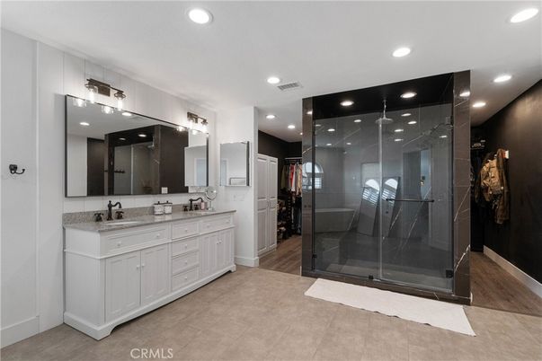 Bathroom, Dual Sink Vanities, Glass Shower, Interior, Recessed Lighting, Wood Texture Flooring