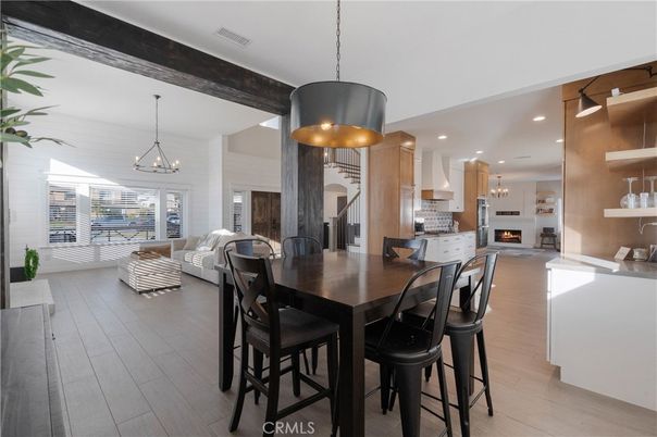 Chandelier, Dining room, Fireplace, Interior, Kitchen, Living room, Pendant Lights, Recessed Lighting, Wood Texture Flooring