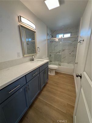 Bathroom, Dual Sink Vanities, Interior, Marble Walls, Wood Texture Flooring