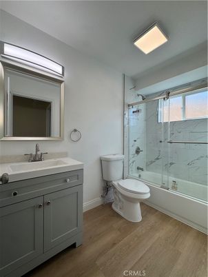 Bathroom, Glass Shower, Interior, Marble Walls, Recessed Lighting, Wood Texture Flooring