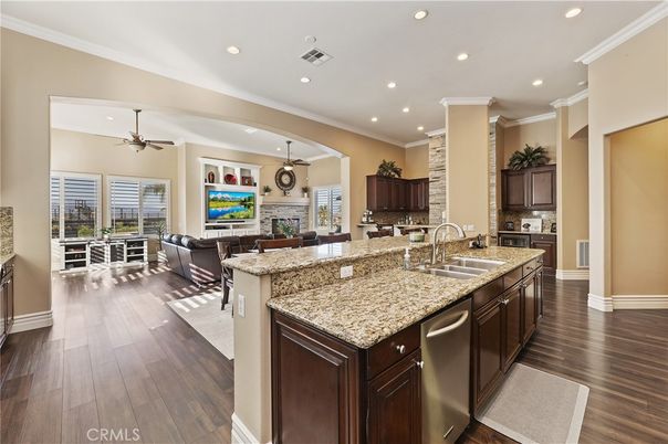 Dining room, Fireplace, Interior, Kitchen, Living room, Pendant Lights, Recessed Lighting, Stainless Steel Appliances, Wood Texture Flooring