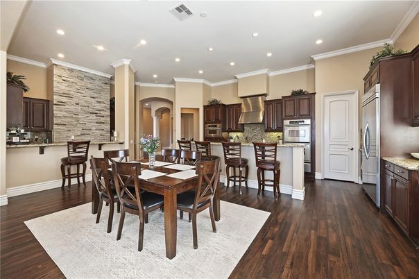 Dining room, Interior, Kitchen, Recessed Lighting, Stainless Steel Appliances, Stone Walls, Wood Texture Flooring