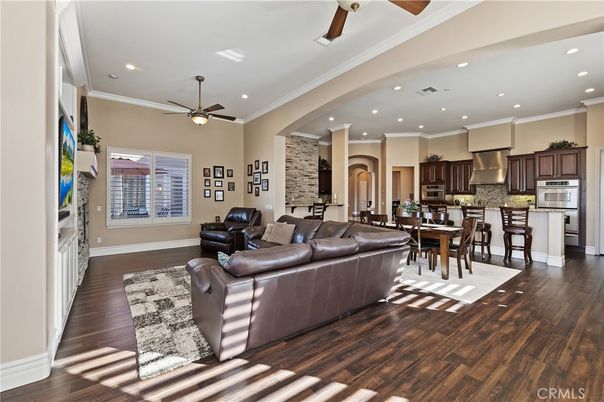 Dining room, Interior, Kitchen, Living room, Recessed Lighting, Stainless Steel Appliances, Stone Walls, Wood Texture Flooring