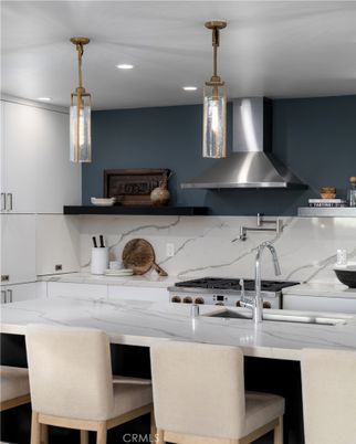 Interior, Kitchen, Marble Walls, Pendant Lights, Recessed Lighting, Stainless Steel Appliances