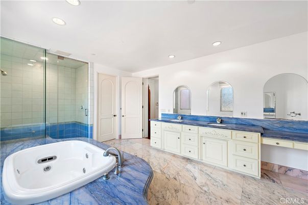 Bathroom, Dual Sink Vanities, Glass Shower, Interior, Marble, Recessed Lighting