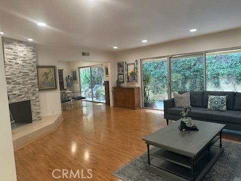 Fireplace, Interior, Living room, Recessed Lighting, Stone Walls, Wood Texture Flooring