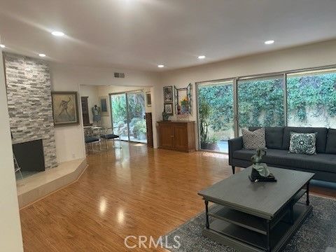 Fireplace, Interior, Living room, Recessed Lighting, Stone Walls, Wood Texture Flooring