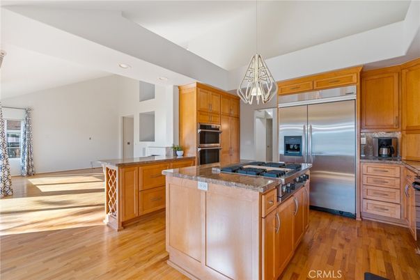 Chandelier, Interior, Kitchen, Pendant Lights, Recessed Lighting, Stainless Steel Appliances, Wood Texture Flooring
