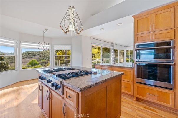 Chandelier, Interior, Kitchen, Pendant Lights, Recessed Lighting, Stainless Steel Appliances, Wood Texture Flooring