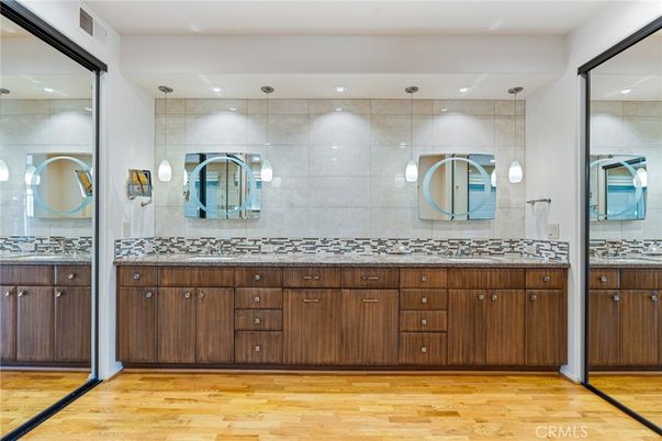 Bathroom, Dual Sink Vanities, Interior, Pendant Lights, Recessed Lighting, Wood Texture Flooring
