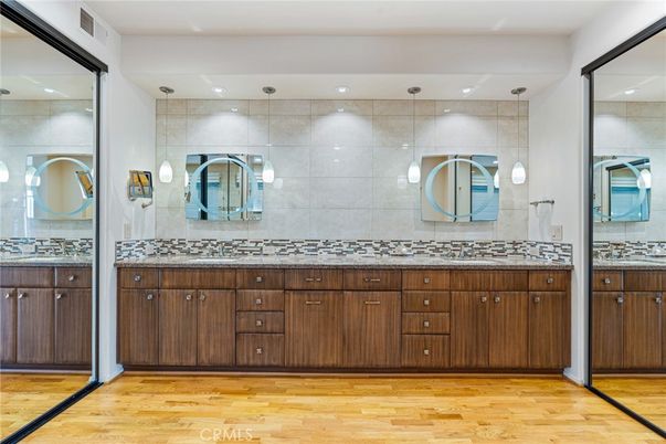 Bathroom, Dual Sink Vanities, Interior, Pendant Lights, Recessed Lighting, Wood Texture Flooring