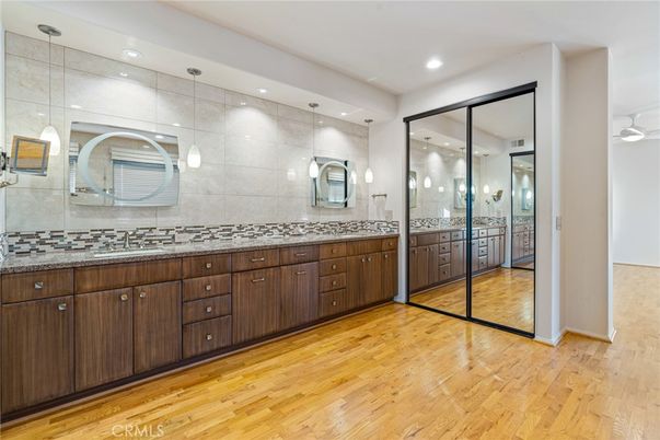 Bathroom, Dual Sink Vanities, Interior, Pendant Lights, Recessed Lighting, Wood Texture Flooring