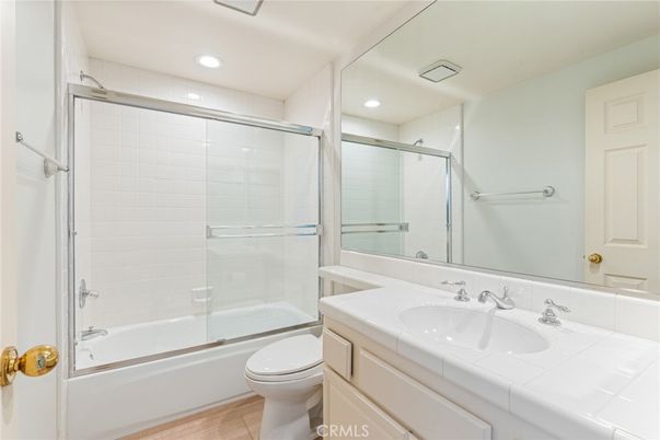Bathroom, Glass Shower, Interior, Recessed Lighting, Tile Countertops, Wood Texture Flooring