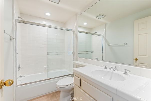 Bathroom, Glass Shower, Interior, Recessed Lighting, Tile Countertops, Wood Texture Flooring