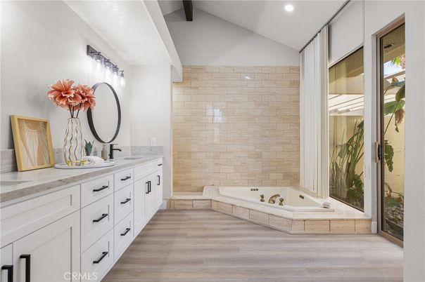 Bathroom, Dual Sink Vanities, Interior, Recessed Lighting, Stone Walls, Wood Texture Flooring
