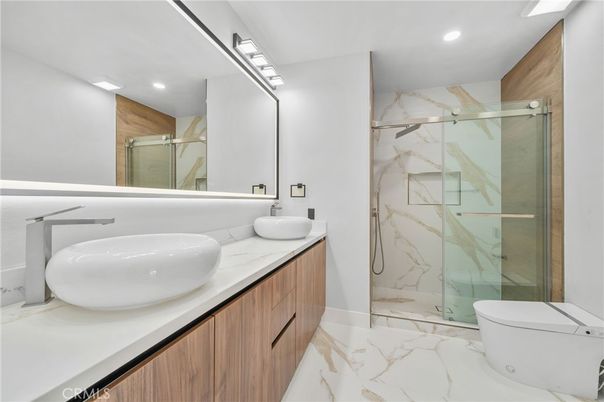 Bathroom, Dual Sink Vanities, Glass Shower, Interior, Marble, Marble Walls, Recessed Lighting