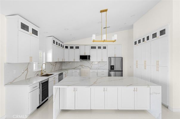 Interior, Kitchen, Marble Walls, Pendant Lights, Recessed Lighting, Stainless Steel Appliances