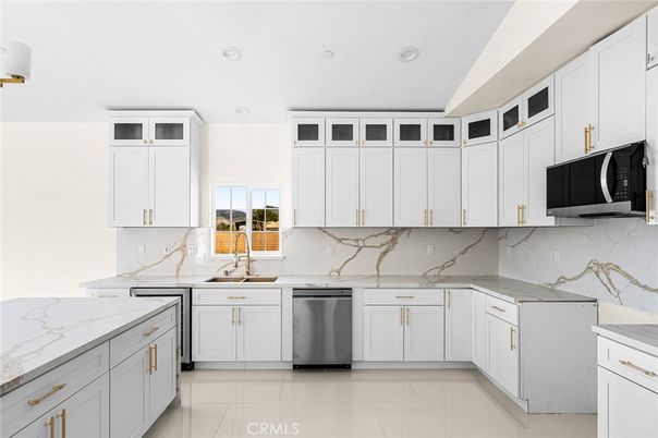 Interior, Kitchen, Marble Walls, Recessed Lighting, Stainless Steel Appliances